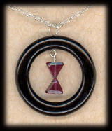 La Veuve Noire garnet and onyx hourglass pendant