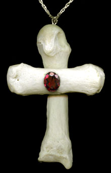 Human bone cross with garnet